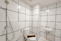 Combined Grey Toned 2BR Apartment at The City Square Surabaya By Travelio