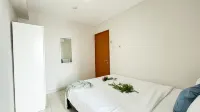 Scandinavian Minimalist 2BR at Cinere Bellevue Suites Apartment By Travelio