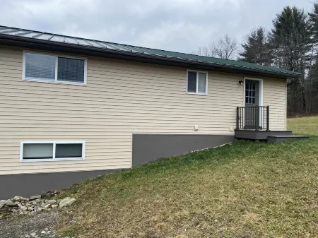 Family friendly cottage, covered deck, close to lake to fish, swim, and boat