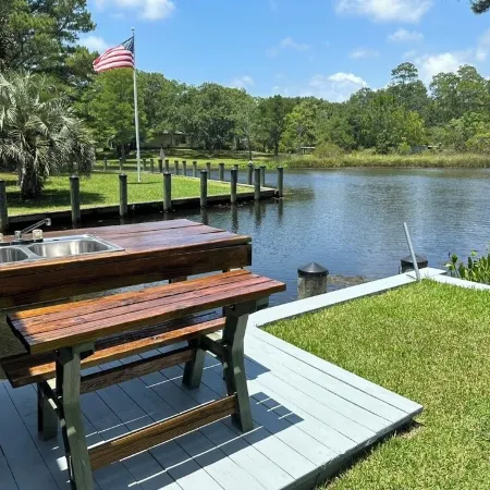 BEAUTIFUL WATERFRONT .  GNAT SCREENED BOATHOUSE AND AJOINING COVERED BOAT SLIPS
