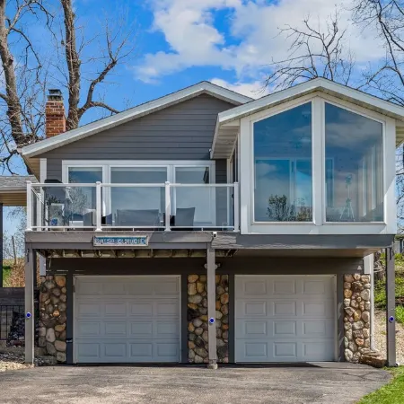 Cozy, year-round lake home with magnificent sunset views, lake access and dock.