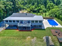 Ultimate Waterfront Escape: Poolside Relaxation & Fishing, Kayak & Fire Pit Fun!