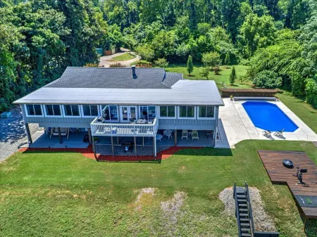 Waterfront Oasis: Relax by the Pool, Fish, Kayak, and Enjoy Fire Pit Gatherings!