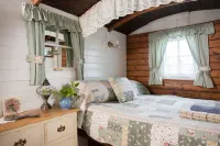 Quirky home with romantic shepherds' hut bedrooms and pretty garden near Padstow