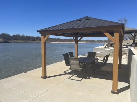 Open modern concept home with large backyard on Lake LBJ with Private Casita!