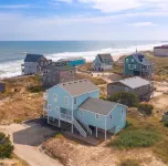 Beachfront 5-bedroom vacation home steps to the beach with hot tub!