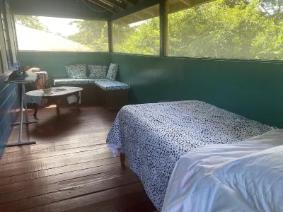 Amazing Jungle Tree House right over the river with bikes and canoe