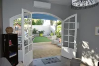 Charming outbuilding with large shaded terrace in private garden