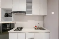 Grey Toned 1BR Apartment Tamansari Skylounge Makassar By Travelio - Daireler