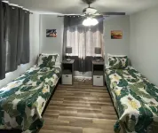 1st floor 2 bedroom/1 full bath unit on one acre family farm close to Hilo, HI.