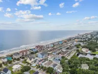 Beach Getaway - First floor unit with Pool and beach access steps away!