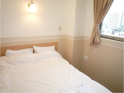 新館ダブルルーム(浴室付き、シティビュー) キヨナミホテルの写真