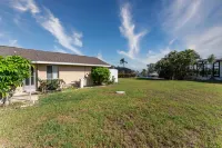 Screened Porch with Canal View and Games - Charming Vintage Oasis