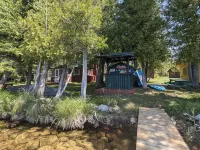 Dock and Fire Pit with Sandy Bottom - Cozy Log Cabin Retreat