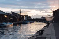 مينكا ريفر سايد فيلاز فنادق في إميزو