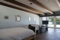 Large beachfront loft apartment in gated community Playa La Misión with deck.