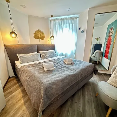 Stylish granny apartment with box-spring bed