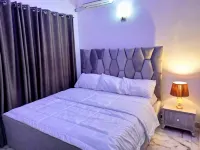 Lovely 2-Bedroom Serviced Apartment with a Balcony Hotels near African University of Science and Technology