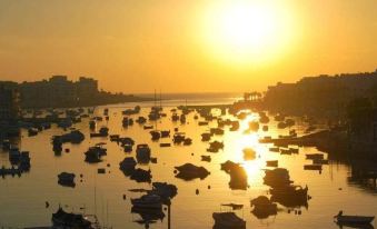 a large body of water with numerous boats floating on it , creating a beautiful scene at Hotel Kennedy Nova