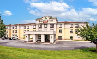"a large hotel with a red roof and the name "" hawthorn suites by wyndham "" on it" at SpringHill Suites Hershey Near the Park