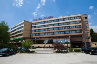 Hotel Grand Hotels near Diego Maradona mural in Bosnian colors