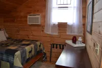 Cozy Pet Friendly Mountain Log Cabin in the Smokies with Deck and fire pit.