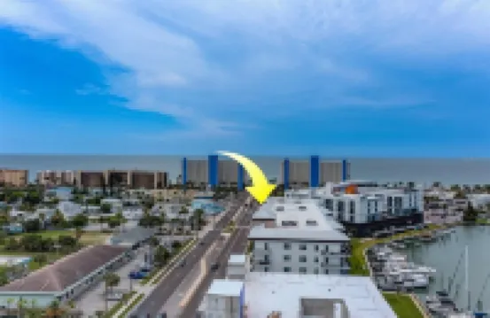 Luxury new condo steps to the beach with Gulf Views, heated pool, & hot tub