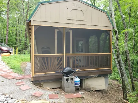 Pet friendly cottage on 17 acre Lake front property with dock and kayak access