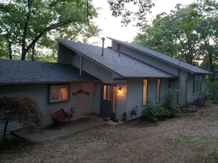 Quiet  Location, Beautiful Lakefront Home in a Cove. Private Covered Boat Dock!