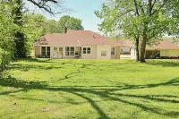 Charming 2-bedroom cottage in scenic Southwest MO with a large corner lot.