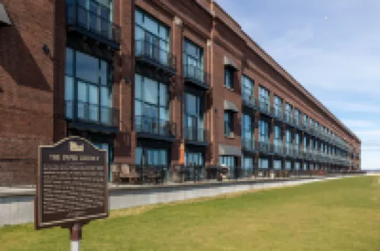 Balcony with Partial Lake View and Pool Access - Charming Condo Escape