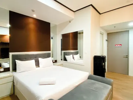 Cozy and Homey Studio at Vasanta Innopark Apartment Отели рядом с достопримечательностью «Bonecom Tricom Mm2100»