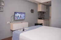 Minimalist Studio Room at Urbantown Serpong Apartment