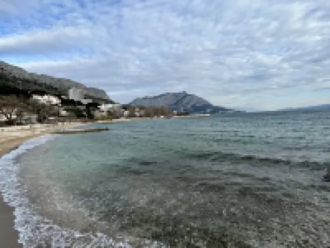 Seafront villa, sandy beach, heated pool, sauna, fitness,. Hotels in Duce