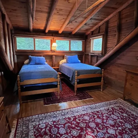 Renovated 3-BR boathouse built atop water in quiet cove; private float & trails