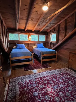 Renovated 3-BR boathouse built atop water in quiet cove; private float & trails - Wifi