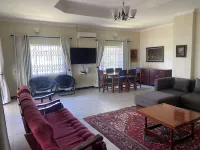 Spacious 4-bedroom beach house with WiFi, AC in beautiful Monkey Bay Hotels in Mangochi