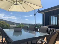 Stunning water views; relaxed coastal atmosphere; multiple entertaining areas