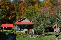 Restored Historical Farmhouse With Pond And Farm Animals At Mohican State Park