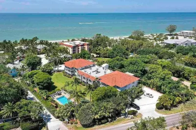 End unit with extra windows. Steps to the beach, private beach access!