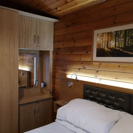 Luxury pine log cabin positioned within the mountains of the Lake District