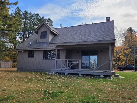 Waterfront house w/ large garage located on trail 8 in Grand Marais.