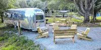 Glamping in Vintage Airstream with modern comforts with private pond access.