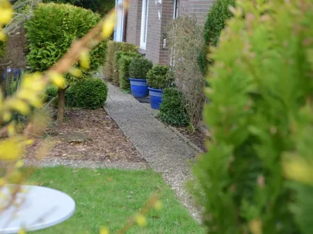 Bright, spacious comfort apartment with private garden and walk-in shower.