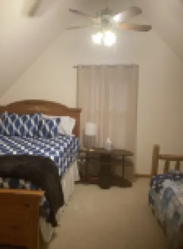 Roomy home with spacious fenced in backyard and fire pit.