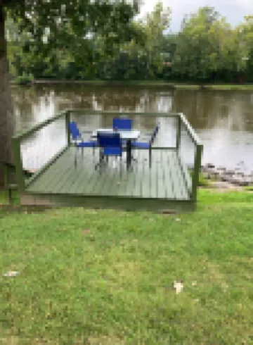 Gound level and private home with 142 feet of river front access.
