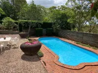 Cranley Garden Retreat with Fireplace & Pool