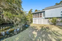 Dog-friendly beach home with screened porch, charming interior, & W/D