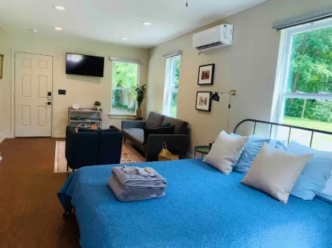 Relaxing Backyard and Cozy Seating Area - Charming Urban Haven