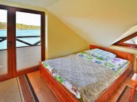 Holiday Home by Lake Rosnowskie with Boat